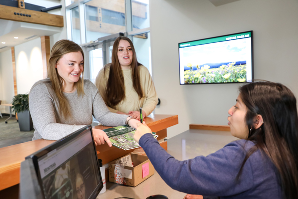 Student worker helping customers.