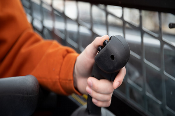 Hand operating vehicle joystick