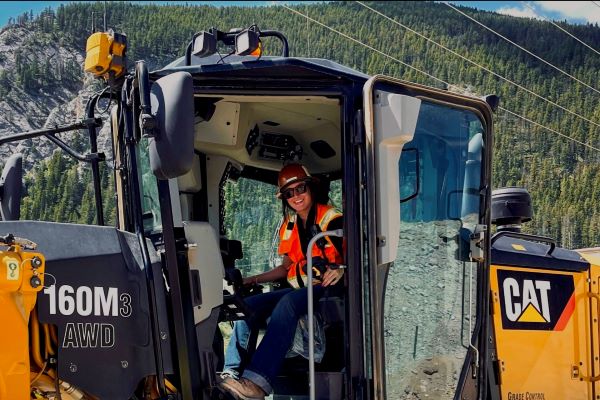 !A female student operates heavy equipment