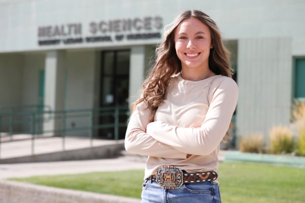 Kally Strohm in front of Health Sciences building