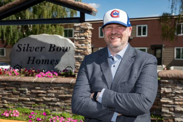 Dr. Richard LaDouceur stands in front of Silver Bow homes