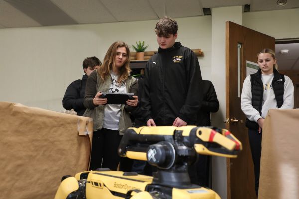 Students operate a robot