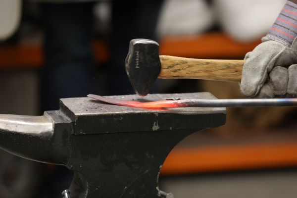 A student works in a blacksmithing lab