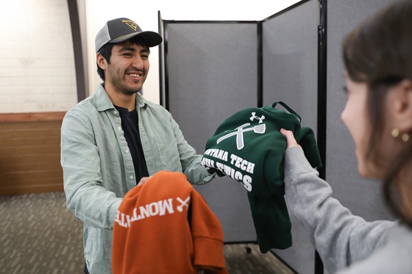 !Two Montana Tech students exchange sweaters