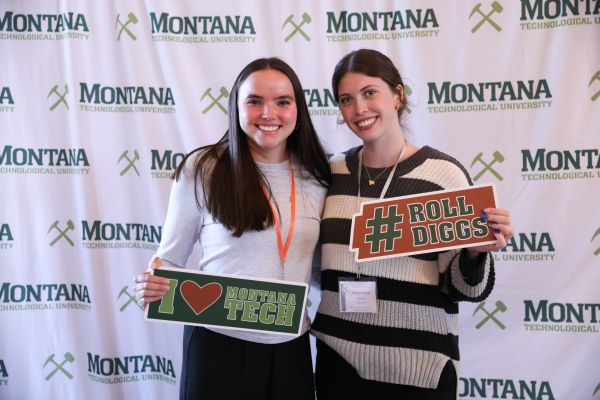 !Students hold Montana Tech signs