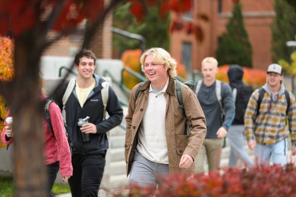 Students walk on campus in autumn
