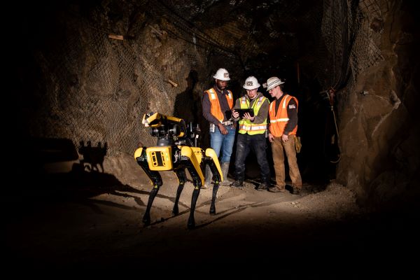 Spot, a Boston Dynamics robot, working in the UMEC with three students