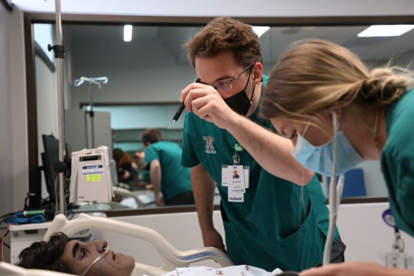 Students work with a dummy 